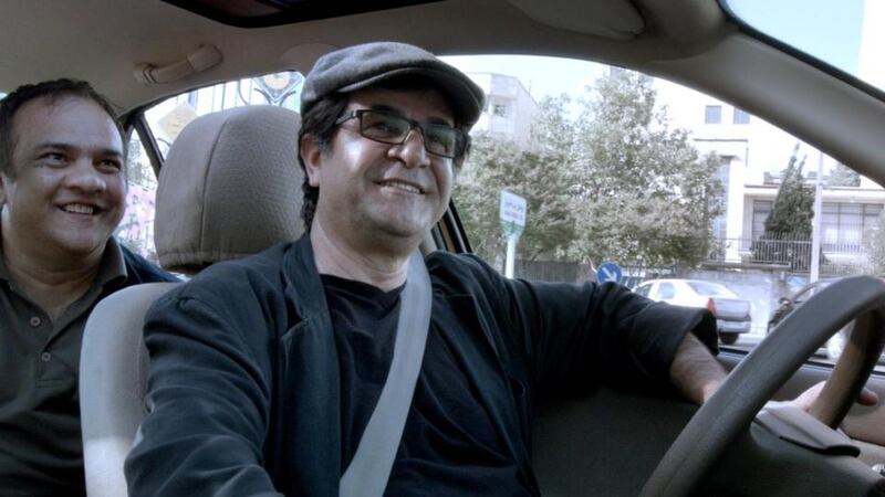 This handout film grab image released by the International film Festival Berlinale shows Iranian dissident director Jafar Panahi playing the role of a taxi driver in his film Taxi, for which he received the Golden Bear. Photograph: AFP