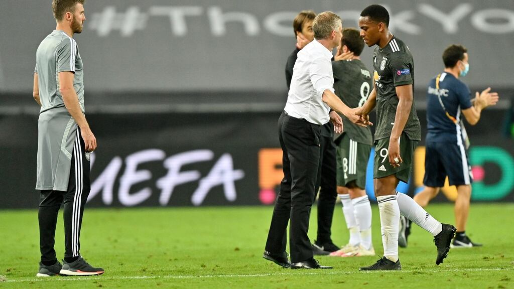 Manchester United manager Ole Gunnar Solskjaer consoles Anthony Martial after their side’s defeat to Sevilla in the Uefa Europa League semi-finals at RheinEnergieStadion in Cologne, Germany. Photo: Martin Meissner/Pool via Getty Images