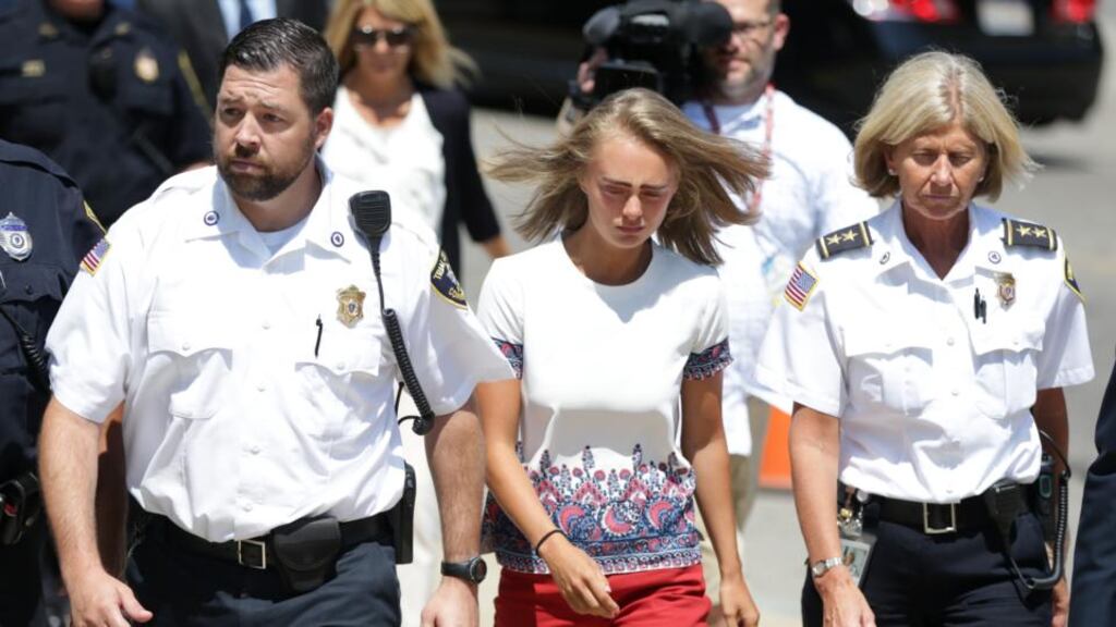Michelle Carter (centre) is escorted into the Taunton District Court in Taunton, Massachusetts for her sentencing hearing on August 3rd 2017 Photograph: Jonathan Wiggs/The Boston Globe/Getty