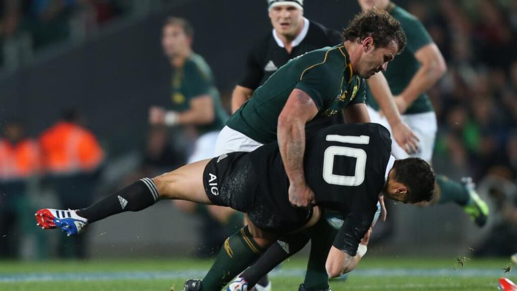 South Africa’s Bismarck Du Plessis hits New Zealand outhalf Dan Carter during The Rugby Championship match at Eden Park in Auckland. Photograph: Sandra Mu/Getty Images