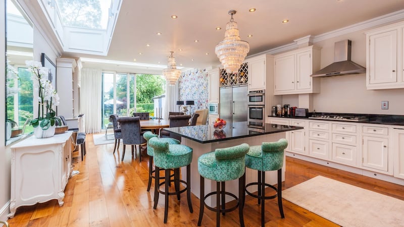 Open-plan kitchen, living, dining area to the rear