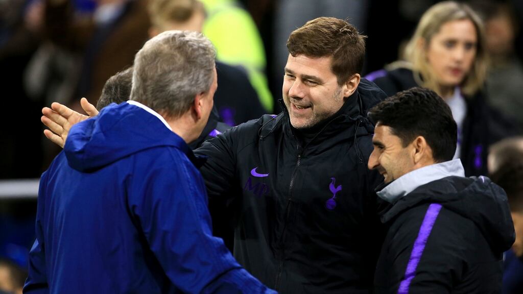 Tottenham Hotspur manager Mauricio Pochettino shakes hands with Cardiff boss Neil Warnock before the Premier League match. Photo: Mark Kerton/PA Wire