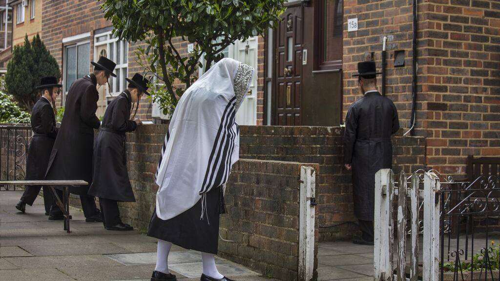 Sabbath prayer meeting outside a house in Stamford Hill, London,  by ultra-orthodox Hassidic Jews in April 2020. Photograph: Barry Lewis