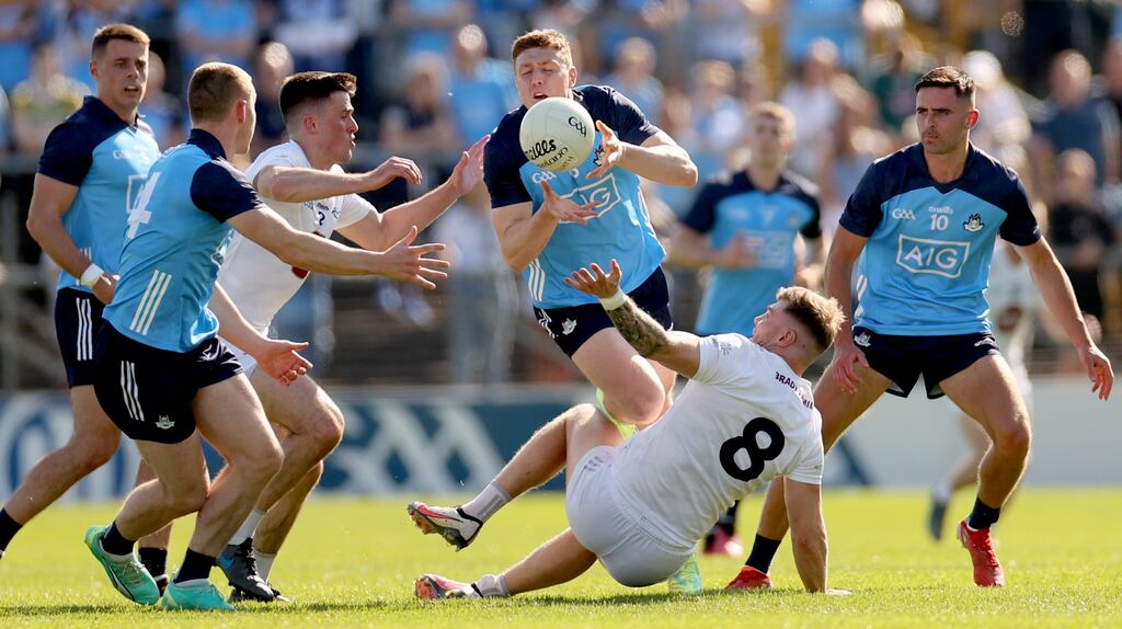 Dublin's John Small is challenged by Mick O'Grady and Kevin O'Callaghan of Kildare during the All-Ireland SFC round two game at  UPMC Nowlan Park in Kilkenny. Photograph: James Crombie/Inpho