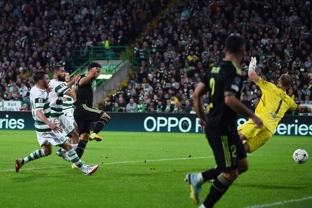 Real Madrid's Eden Hazard scores his side's third goal past Celtic goalkeeper Joe Hart during the Champions League match at Celtic Park. Photograph: Andy Buchanan/AFP via Getty Images