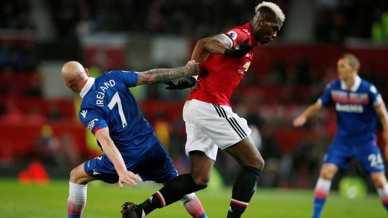 Stoke City’s Stephen Ireland challenges Manchester United’s Paul Pogba during the Premier League game at Old Trafford. Photograph: Andrew Yates/Reuters