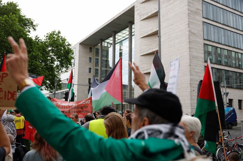 Participants display Palestinian flags and flash the victory sign during a demonstration in support of Palestinians outside the foreign office in Berlin, during a visit by Israel's foreign minister Gideon Sa'ar to the German capital. Photograph: Odd Andersen/AFP via Getty Images