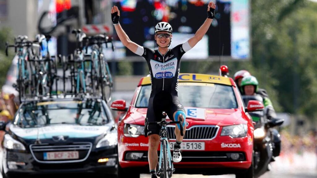 Omega Pharma Quick Step Procycling team rider Tony Martin of Germany celebrates as he crosses the finish line to win the ninth stage of the 101st Tour de France  from Gerardmer to Mulhouse. Photograph: Kim Ludbrook/EPA