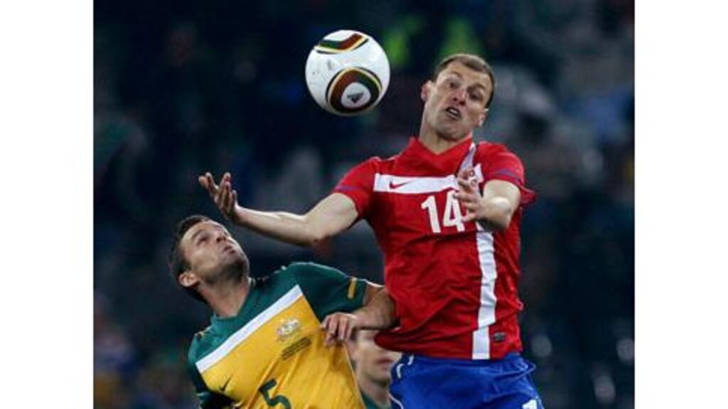 Australia's Jason Culina (L) fights for the ball with Serbia's Milan Jovanovic during a World Cup Group D soccer match at Mbombela stadium in Nelspruit Reuters/Daniel Munoz