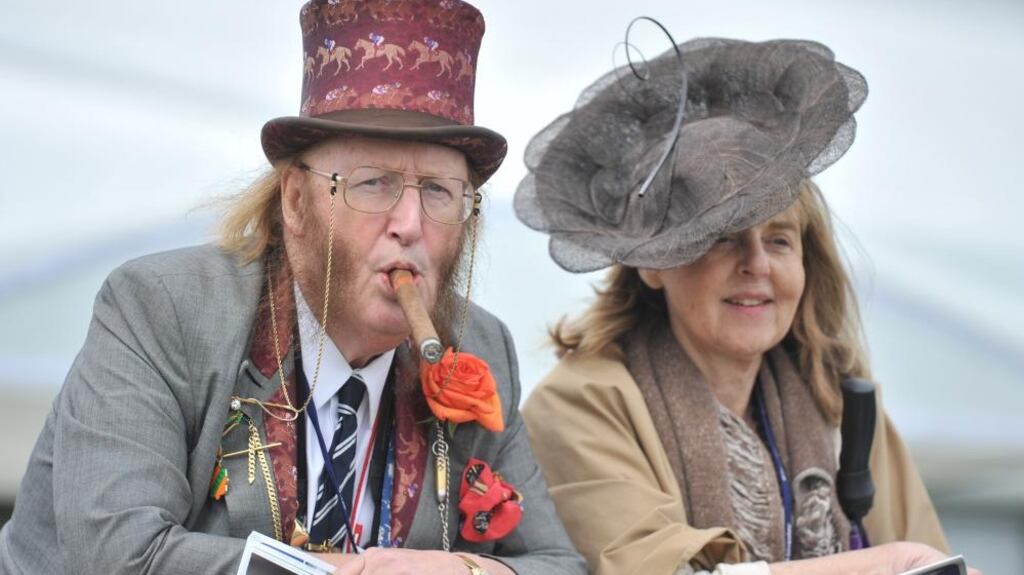 John McCririck with his wife, Jenny, at the Derby in 2009. Photograph: Javier García/Rex/Shutterstock