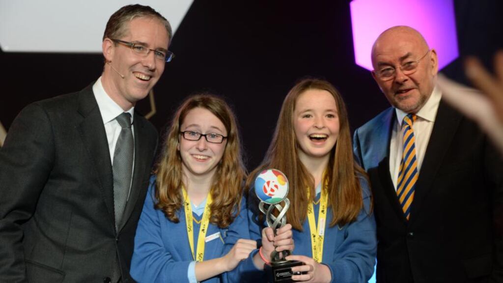 Eve Casey and Cathy Hynes from Kinsale Community School, winners of the Best Group BT Young Scientist & Technologist 2014 Award with their project, a study using statistical methods of people’s attitudes to the ageing workforce of the future. Presenting the awards are Colm O’Neill, chief executive of BT Ireland, and Minister for Education Ruairí Quinn. Photograph: Alan Betson