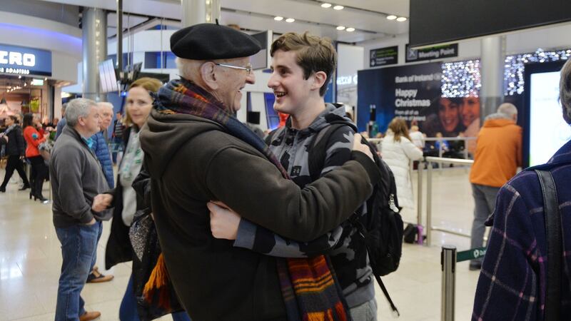 David Goldberg hugging his grandson Gerald Bires back from Boston at Dublin Airport. Photograph: Alan Betson / The Irish Times