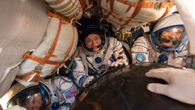 Expedition 52 Flight Engineer Peggy Whitson, Commander Fyodor Yurchikhin of Roscosmos and Fight Engineer Jack Fischer of Nasa inside the Soyuz MS-04 spacecraft shortly after it landed near the town of Zhezkazgan, Kazakhstan