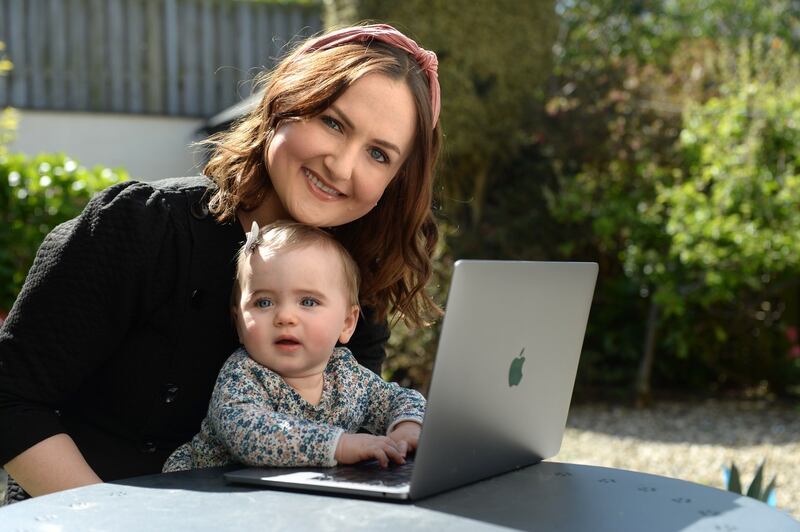 Ciara Reilly, a teacher trainer  in digital education, pictured working from home in Dublin with her daughter, Doireann. Photograph: Dara Mac Dónaill/The Irish Times