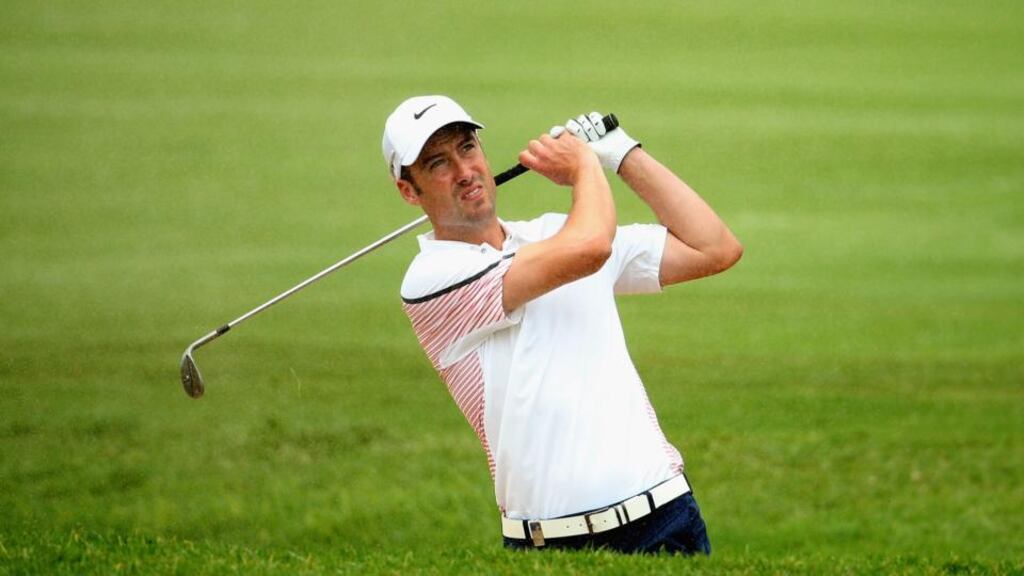Ross Fisher plays out of the fourth fairway bunker during the third round of the Tshwane Open at Copperleaf  Estate. Photograph: Warren Little/Getty Images