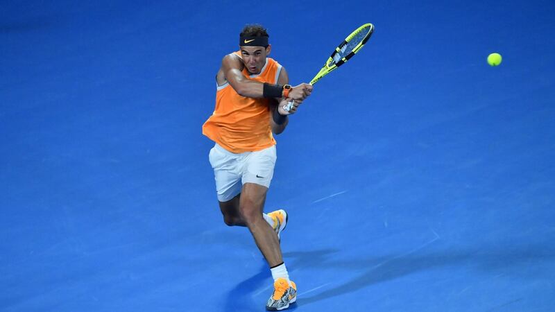 Spael Nadal plays a backhand return to Frances Tiafoe during their men’s singles quarter-final match at the Australian Open in Melbourne. Photo: Paul Crock/Getty Images