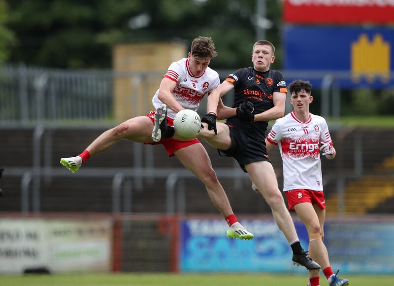Armagh's Jack Loughran challenges James Sargent of Derry for a high ball during the Electric Ireland Ulster MFC final. Photograph: Leah Scholes/Inpho