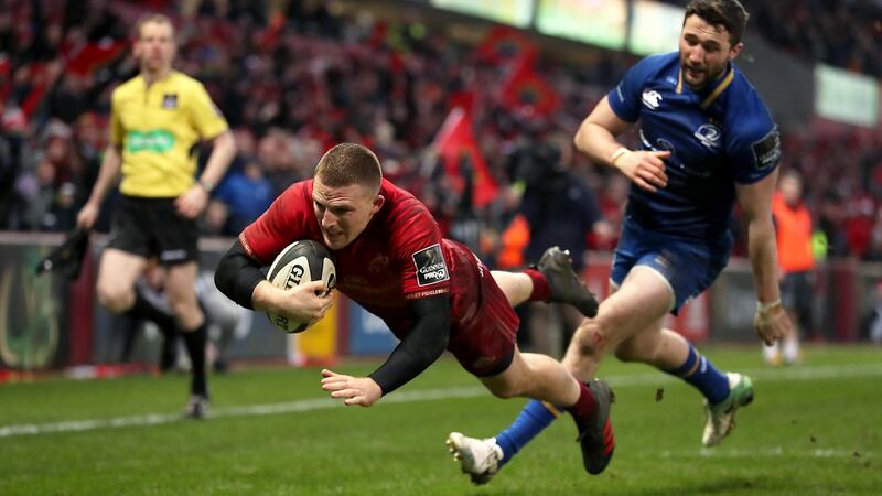 Munster’s Andrew Conway scores one of his two tries in the Guinness Pro 14 match against Leinster at Thomond Park. Photograph: Billy Stickland/Inpho