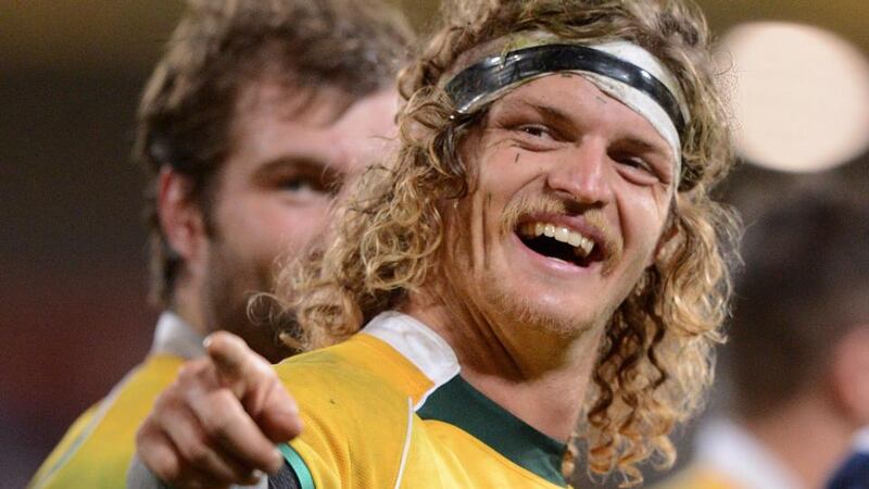 Australia’s Nick Cummins celebrates after the final whistle at Suncorp Stadium in Brisbane. Photograph: Dave Hunt / EPA