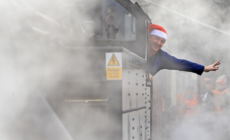 Steam train driver Robert Jolley waves as the Santa Express departs from Connolly Station Photograph: Donall Farmer/The Irish Times