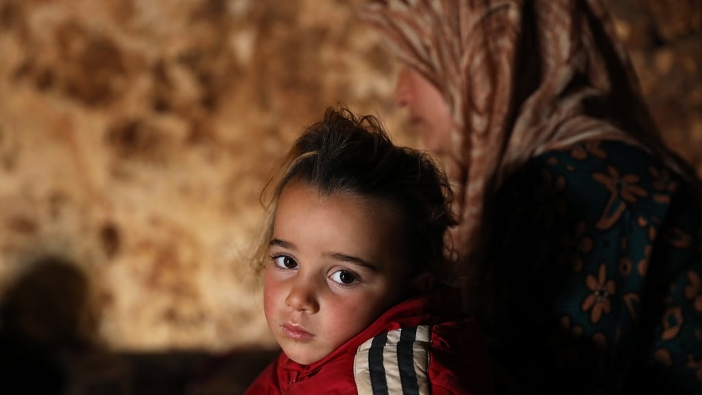 A displaced child looks on at an underground shelter in the Taltouna village, 17 km northwest of the city of Idlib on Saturday. Photograph: Yahya Nemah/ EPA