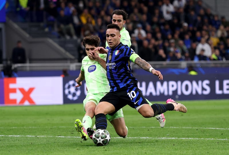 Inter's Lautaro Martinez is fouled by Barcelona's Pau Cubarsi. Photograph: Carl Recine/Getty Images