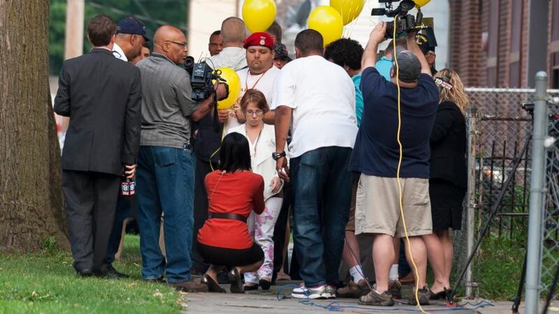 Michelle Knight (centre) talks with reporters outside the home of Ariel Castro in Cleveland, Ohio. Photograph: Getty