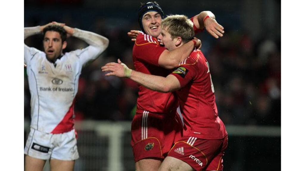 Munster's Niall Ronan congratulates Ivan Dineen after he scored a late match winning try against Ulster in their Magners League clash at Ravenhill (Photograph: Morgan Treacy/Inpho)