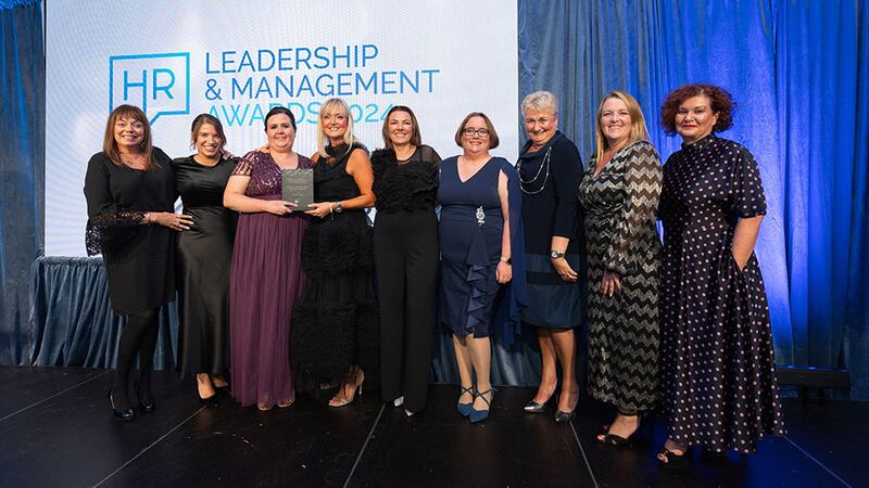 Ciara Connolly, commercial director, Excel Recruitment, presents the HR team of the year (large - over 250+ employees) award to the Primeline Group team