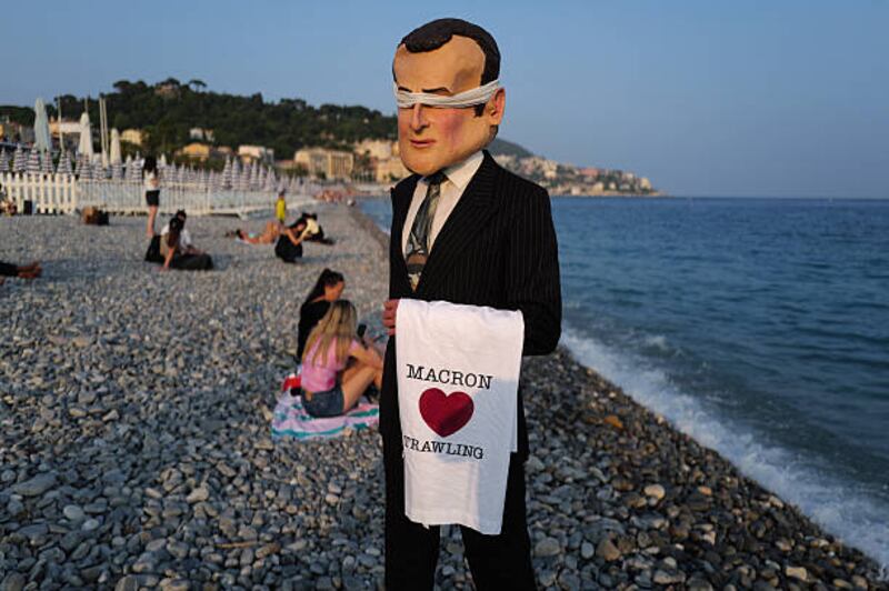 A member of the Ocean Rebellion activist group dressed as French president Emmanuel Macron on the sidelines of the UN ocean conference in Nice. Photograph: Valery Hache/AFP via Getty Images