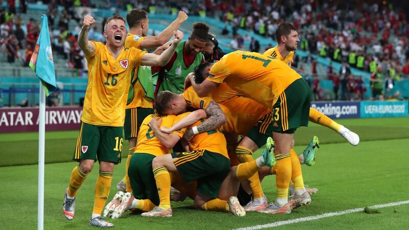 Wales celebrate after Connor Roberts’ late goal in their 2-0 win over Turkey. Photograph: Tolga Bozoglu/Getty