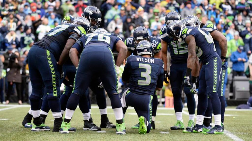 Quarterback Russell Wilson leads his Seattle Seahawks team-mates in prayer moments after providing a touchdown pass against Green Bay Packers in the second half of their NFC Championship Playoffs at CenturyLink Field in Seattle. Photograph: John G Mabanglo/EPA