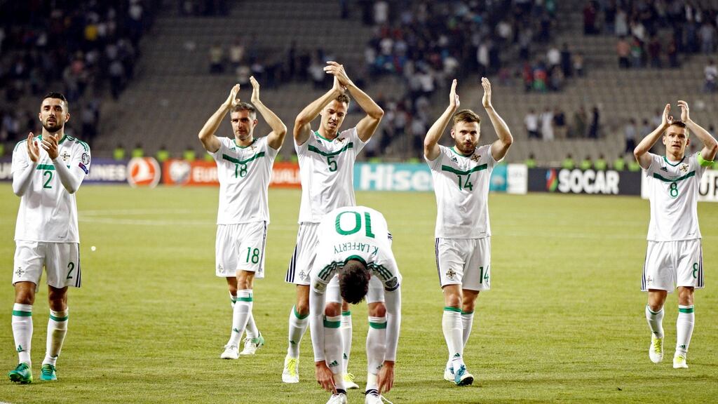 The Northern Ireland players applaud the fans at the end of the match. Photograph: David Mdzinarishvili/Reuters