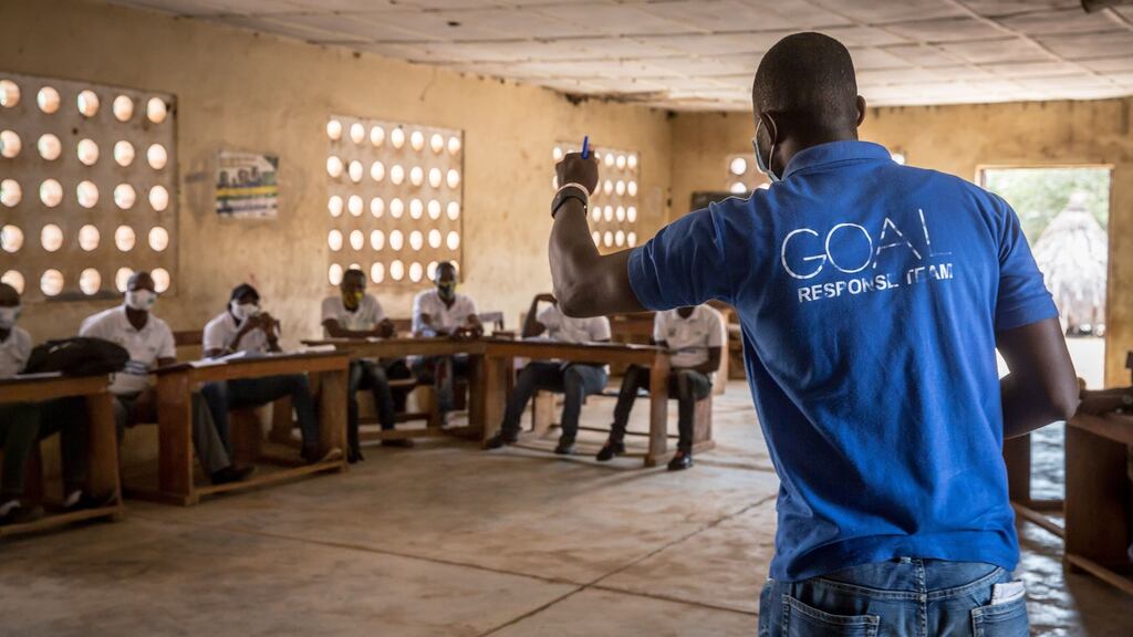 A facilitator from the charity Goal leads a training for community mobilisers who will help their areas create action plans focused on what to do if Ebola spreads across the border to Sierra Leone. Photograph: Sally Hayden