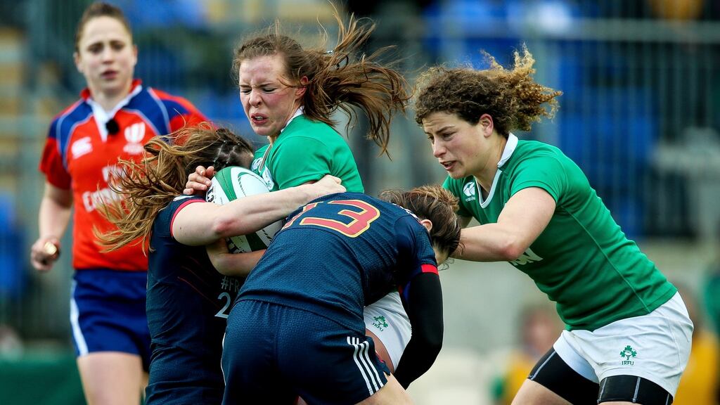Ireland’s Claire McLaughlin with Elodie Poublan of France during their Six Nations encounter in Donnybrook. Photo: Inpho