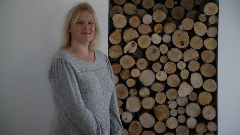 Sally Burnham at the log store at her home in Greystones. Photograph: Nick Bradshaw for The Irish Times