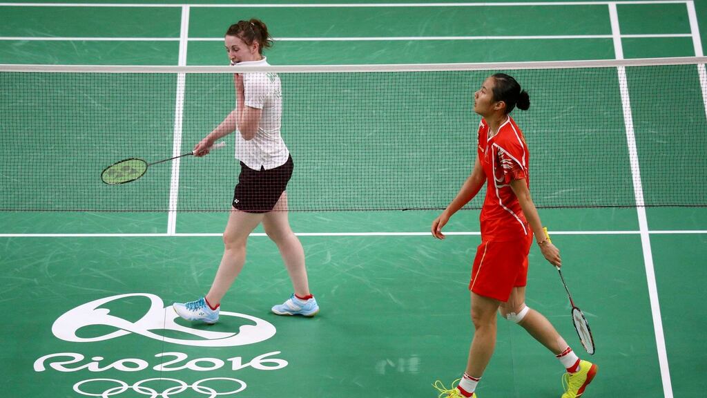 Wang Yihan of China and Chloe Magee walk off the court after Wang won their match. Photo: Marcelo Del Pozo/Ireland