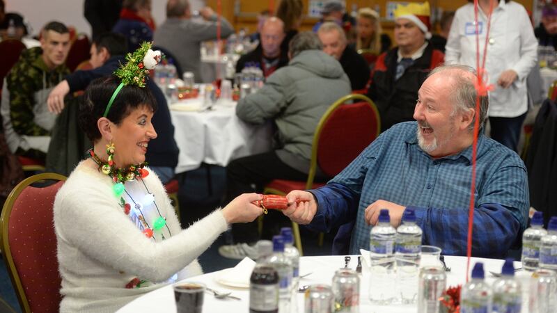 Barry Walsh with volunteer Maeve Cahalan at the Knights of Columbanus Christmas dinner, in the RDS Dublin. Photograph: Dara Mac Dónaill / The Irish Times.