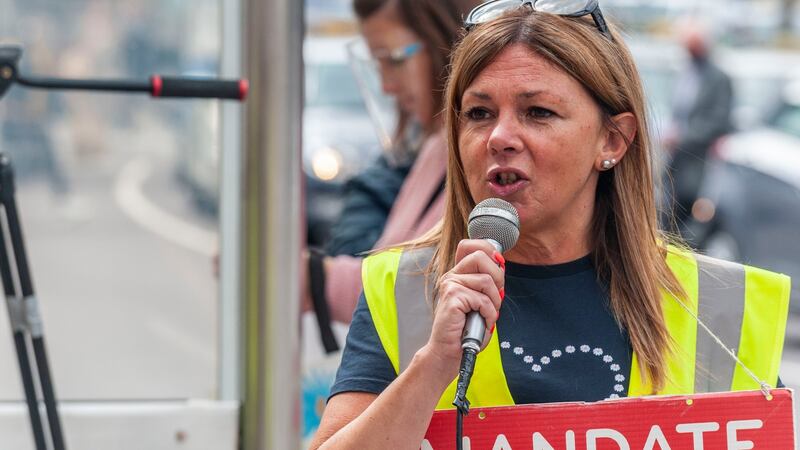 Protester Madeline Whelan speaks at the rally outside the former Debenhams store on Patrick Street, Cork. Photograph: Andy Gibson