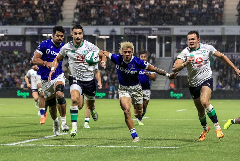 Ireland’s Conor Murray beats Samoa’s Jonathan Taumateine to the ball to score their second try. File photograph: Dan Sheridan/Inpho