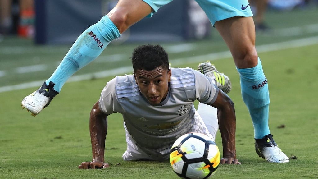 Jesse Lingard challenges Ivan Rakitic during Manchester United’s defeat to Barcelona. Photograph: Patrick Smith/Getty