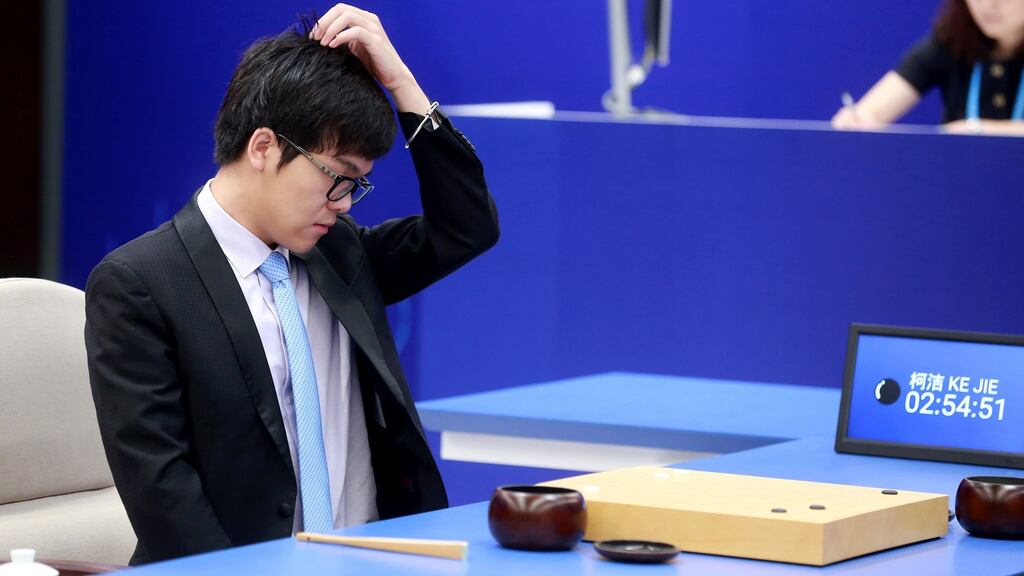 China’s 19-year-old Go player Ke Jie reacts during the first match against Google’s artificial intelligence programme AlphaGo.