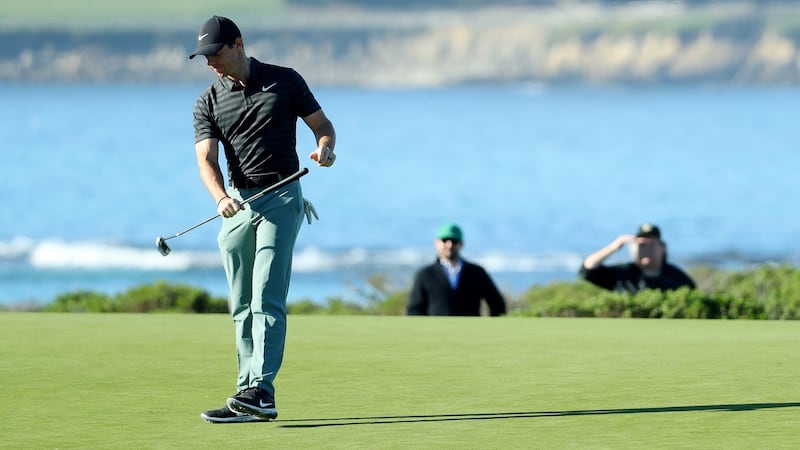 McIlroy reacts after missing a putt on the 13th. Photo: Mike Ehrmann/Getty Images