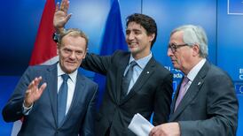 EU signs free trade deal with Canada but hurdles remain