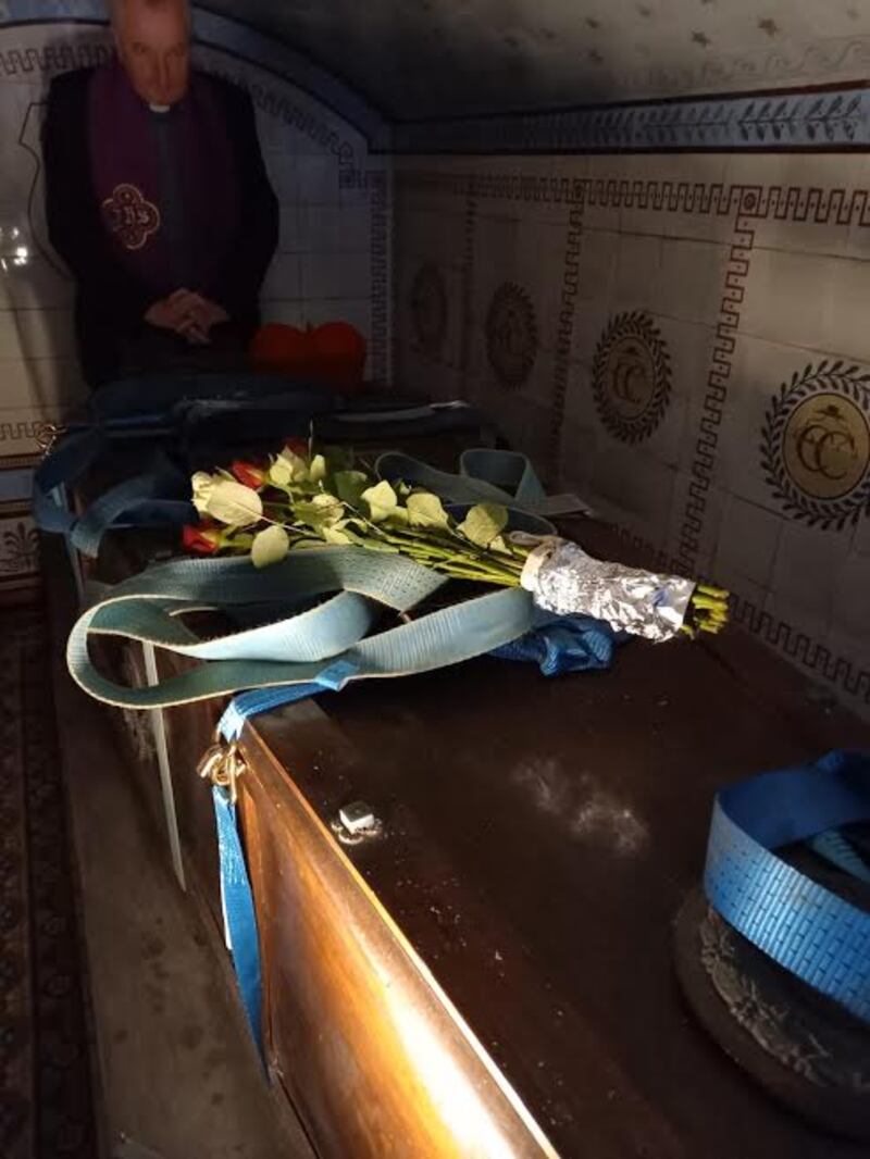 Msgr Ciarán O’Carroll prays over the remains of Cardinal Paul Cullen, resting under high altar at chapel in Clonliffe College.