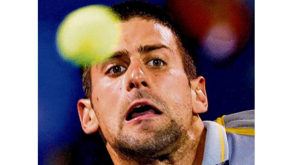 Novak Djokovic: overcame a late stumble to progress