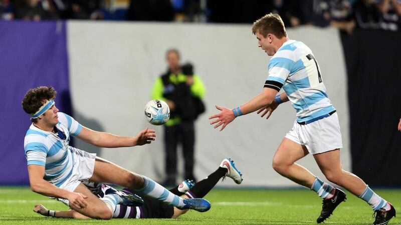 Blackrock’s Caelan Doris offloads to Roghan McMahon during their Leinster Schools Senior Cup tie against Terenure College in 2021. Photograph: Colm O’Neill/Inpho