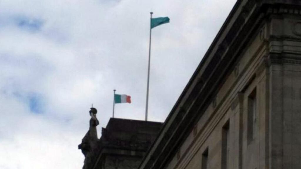 The Tricolour and another unsanctioned flag flying over Parliament Buildings at Stormont. Photograph: Winston Irvine/PUP/PA Wire