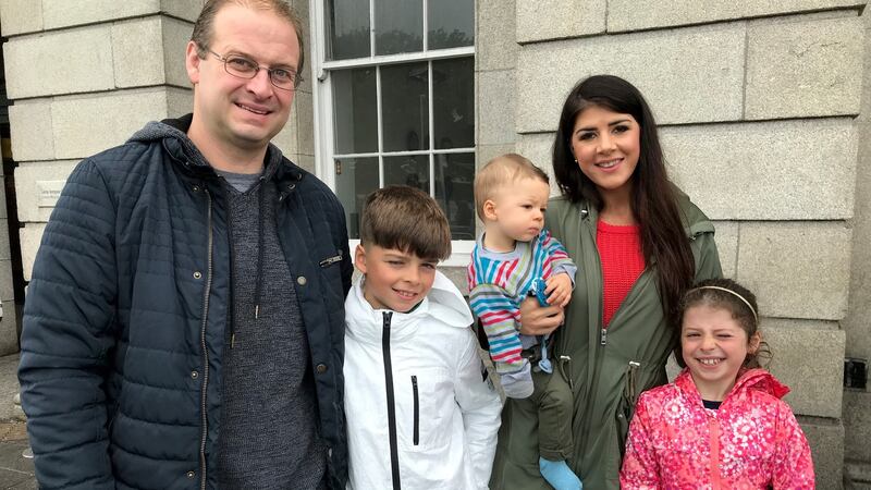 Brian and Marie Smith and their three children, Calum (10), Cara (8) and  Aaron (1)  from Portarlington, Co Laois, on their way to attend the papal mass at Dublin’s Phoenix Park. Photograph: Michelle Devane/PA