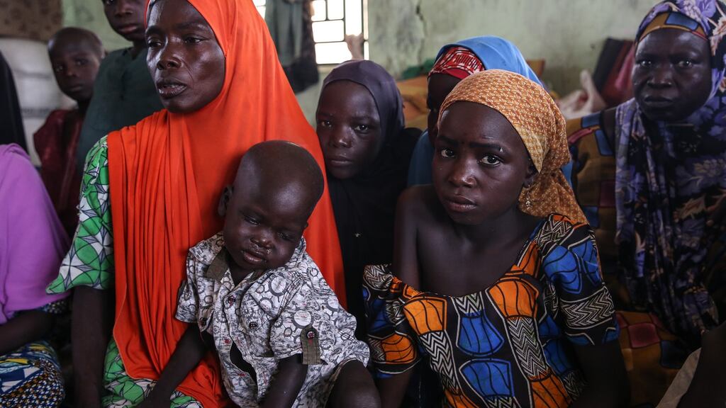 Recently returned people sit in a camp for the displaced in Gwoza, Borno State, northeast Nigeria. Photograph: Sally Hayden
